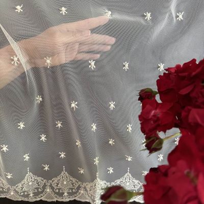Stylish curtain with cream embroidered ornamental pattern and pearl decor